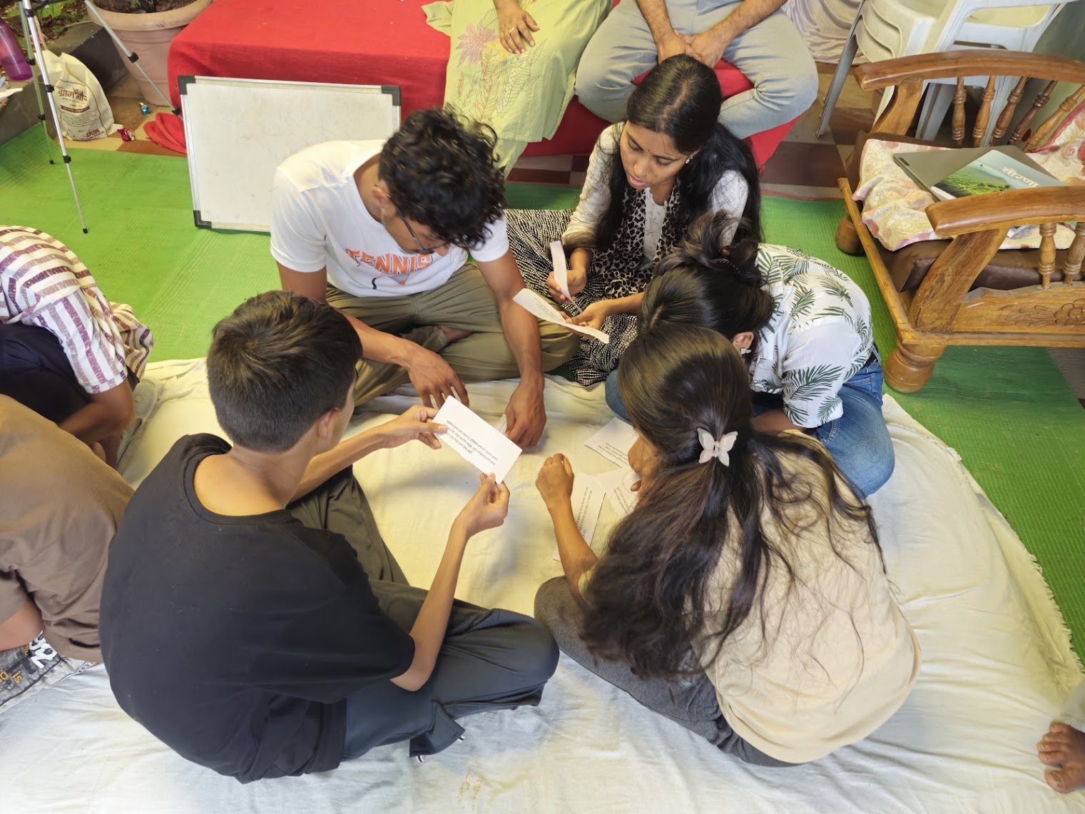Young people working together over prompt cards